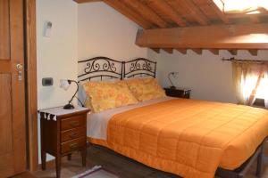 En eller flere senge i et værelse på Corte Tamellini