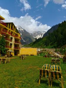 a group of tables and chairs in a field at The Sarai, Naran in Naran