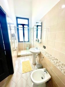 a bathroom with a toilet and a sink at B&B station in Brindisi