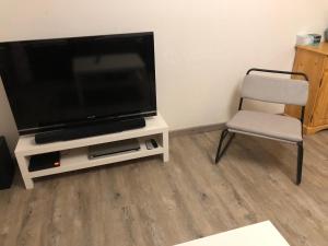 Et tv og/eller underholdning på Bel appartement en duplex