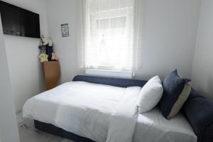 Letto o letti in una camera di Apartman Albijanić