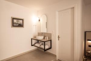 a bathroom with a sink and a mirror at Casa Veneta in Chania