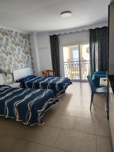 Posteľ alebo postele v izbe v ubytovaní Apartamentos Caracas