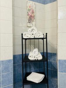 a towel rack with towels on it in a bathroom at Il Magnifico Firenze in Florence