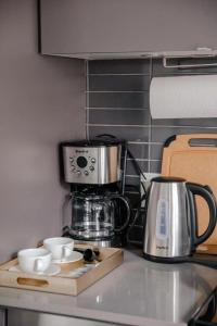 a kitchen counter with a coffee maker on a counter top at Brand New Studio in Heart of Downtown Toronto J8 in Toronto