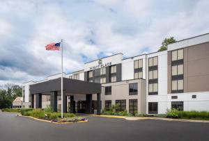 a hotel with an american flag in front of it at Hyatt Place Fair Lawn Paramus in Fair Lawn