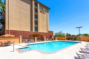 a swimming pool in front of a hotel at Hyatt Place El Paso Airport in El Paso