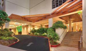 a parking lot in a building with a black road at Hyatt Place Waikiki Beach in Honolulu