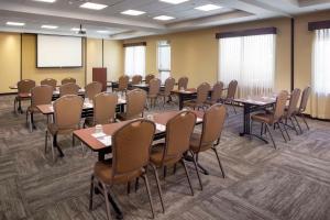 a conference room with tables and chairs and a projection screen at Hyatt Place Phoenix/ Mesa in Mesa