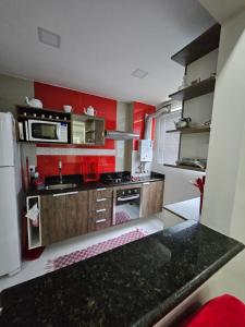 Virtuvė arba virtuvėlė apgyvendinimo įstaigoje HollydayAppartment no Centro Rio das Ostras