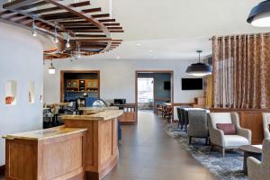 a lobby with a bar and a waiting room at Hyatt Place San Antonio North Stone Oak in San Antonio