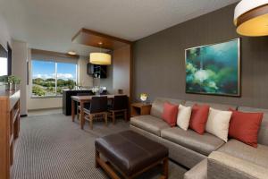 a living room with a couch and a table at Hyatt Place Bayamon in Bayamón