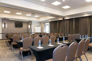 a conference room with tables and chairs and a screen at Hyatt Place Sarasota/Bradenton in Sarasota +72 photos