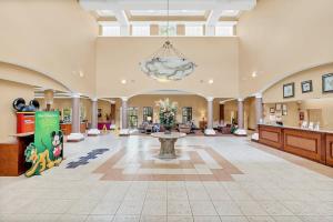 a large lobby with a large room with a table at Casa Magical 1mile to Disney in Orlando
