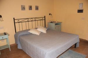 A bed or beds in a room at Podere Turicchio