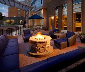 a patio with couches and a fire pit at Hyatt House Pittsburgh Bloomfield Shadyside in Pittsburgh