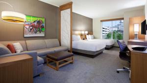 a hotel room with a couch and a bed at Hyatt Place at The Hollywood Casino Pittsburgh South in Washington +36 photos