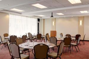 a conference room with tables and chairs in it at Hyatt Place New York Yonkers in Yonkers