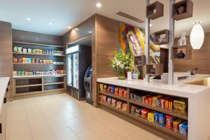 a grocery store aisle with a large display of food at Hyatt House Denver Downtown in Denver