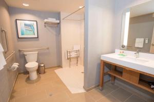a bathroom with a toilet and a sink and a shower at Hyatt Place Cincinnati/Sharonville Convention Center in Sharonville