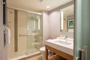 a bathroom with a sink and a toilet and a shower at Hyatt Place Cincinnati/Sharonville Convention Center in Sharonville