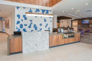 a lobby with a counter in a store at Hyatt Place Cincinnati/Sharonville Convention Center in Sharonville