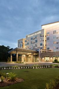 a hotel building with a lawn in front of it at Hyatt Place Biloxi in Biloxi