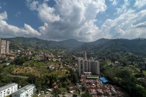 an aerial view of a city with mountains and buildings at Moderno Apartamento en Sabaneta / Medellín in Sabaneta