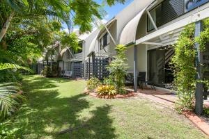 an exterior view of a house with a yard at Nautilus Noosa Holiday Resort in Noosaville