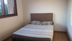 מיטה או מיטות בחדר ב-Marina Casa de campo