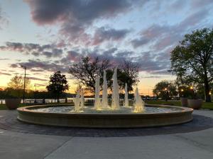 a fountain with water fountains in a park at Cozy 3br Downtown Bakery & Shops! in La Crosse