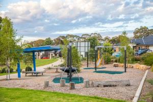a playground in a park with two swings at Mt Baker Home:10km to Hahndorf in Mount Barker