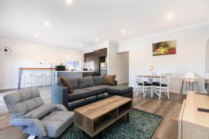 a living room with a couch and a table at Mt Baker Home:10km to Hahndorf in Mount Barker