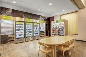 a room with a table and chairs in a store at City Chic Retreat: The Chestnut Serenity in Philadelphia