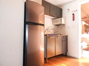 a stainless steel refrigerator in a kitchen at El Refugio de San Matías in Guanajuato