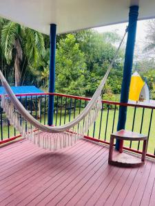 a hammock on the deck of a boat at Finca Hotel el Edén del Quindío in Calarcá