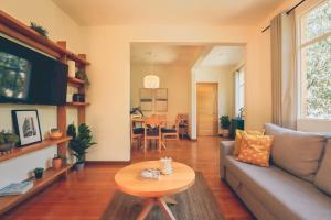a living room with a couch and a table at AirTabacalera in Mexico City