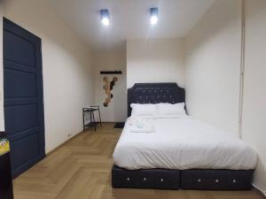 Postel nebo postele na pokoji v ubytování The One Hotel
