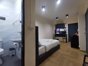 Postel nebo postele na pokoji v ubytování The One Hotel