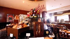 a bakery with a bunch of loaves of bread and pastries at Radisson Collection Hyland Shanghai in Shanghai