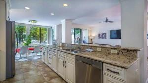 a kitchen with a sink and a counter top at Harbour Town Haven Spacious 4Bd 4Ba Retreat in Hilton Head Island +40 photos