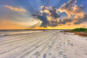 a view of a beach with footprints in the sand at Harbour Town Haven Spacious 4Bd 4Ba Retreat in Hilton Head Island