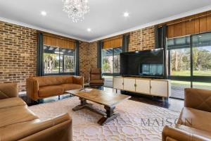 a living room with a couch and a table at Family Getaway in Salt Ash in Salt Ash