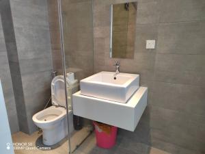 a bathroom with a sink and a toilet at H20 residence studio high floor in Petaling Jaya