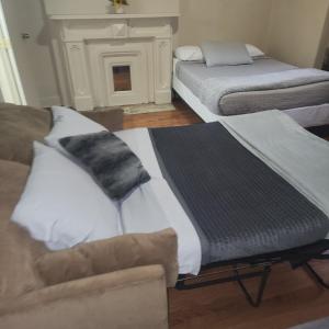 En eller flere senge i et værelse på New York City GuestHouse