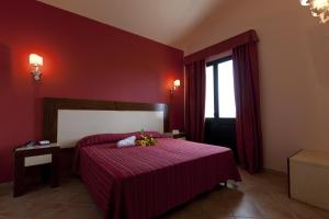 Postel nebo postele na pokoji v ubytování Hotel Baglio Basile