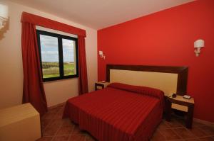 Postel nebo postele na pokoji v ubytování Hotel Baglio Basile