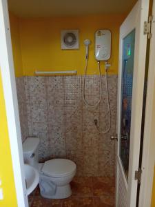 a bathroom with a shower with a toilet and a sink at HomeState Bang Maprao in Ban Hin Sam Kon