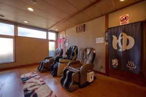 a waiting room with leather chairs in a room at Royal Hotel Kawaguchiko in Fujikawaguchiko +119 photos