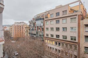a group of tall buildings in a city at Modern and bright apartment in Eixample 5-2 in Barcelona
